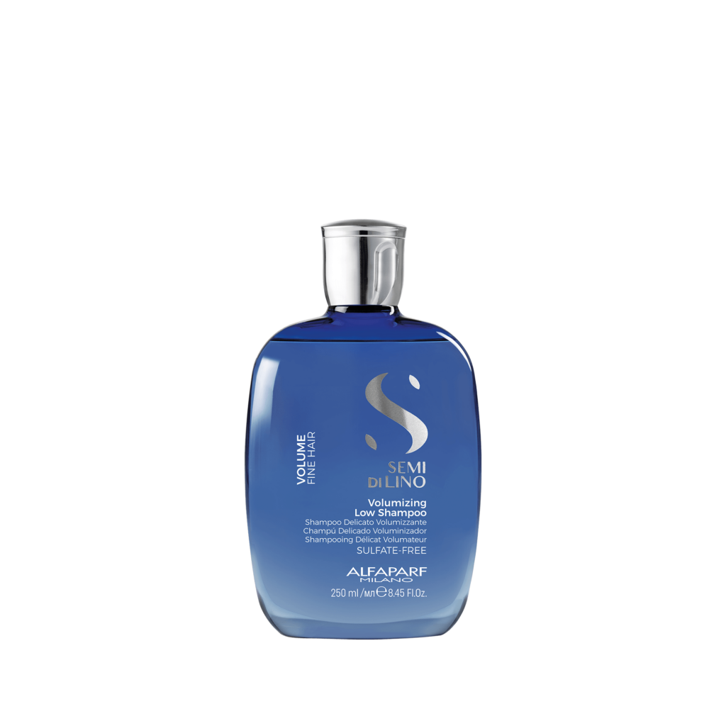 A bottle of blue shampoo on a black background