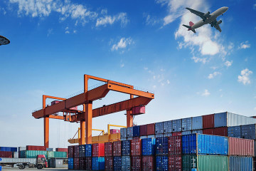 A large cargo ship is docked at the dock.