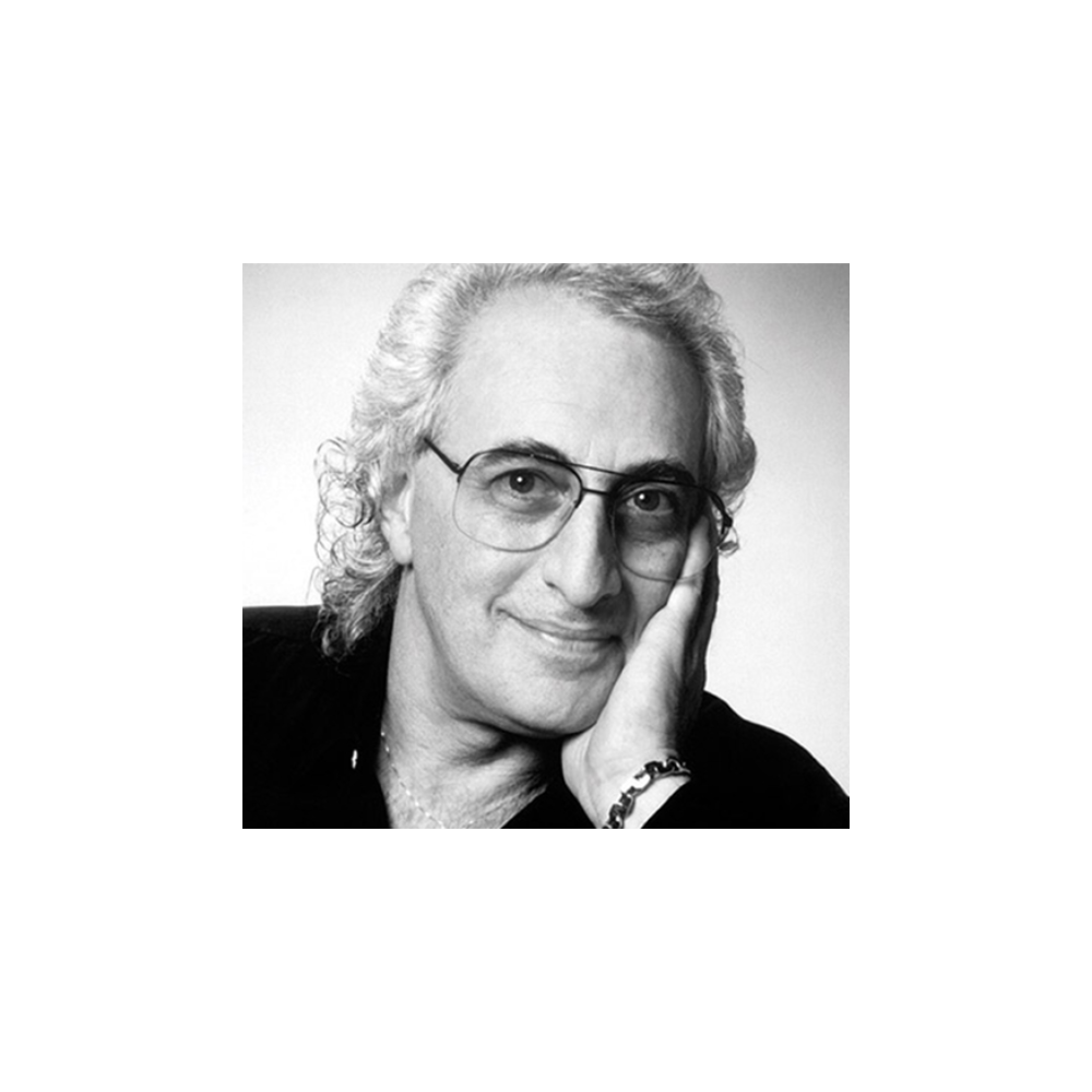 A black and white photo of a man with glasses.