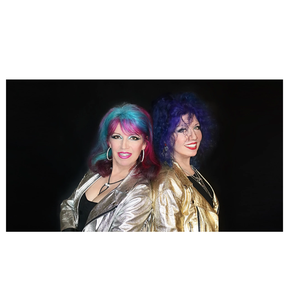Two women with colorful hair posing for a picture.