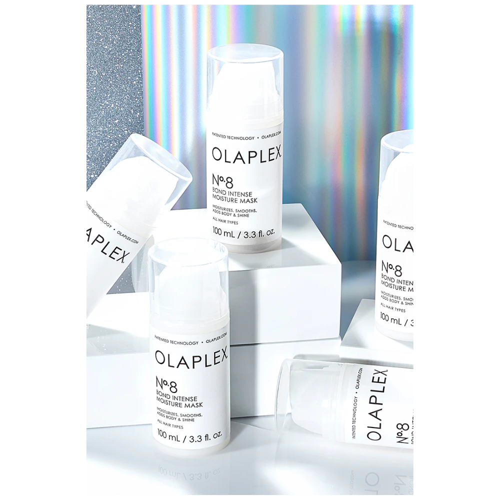 A group of white bottles sitting on top of each other.